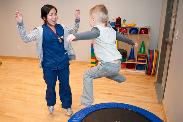 unt faculty playing with child