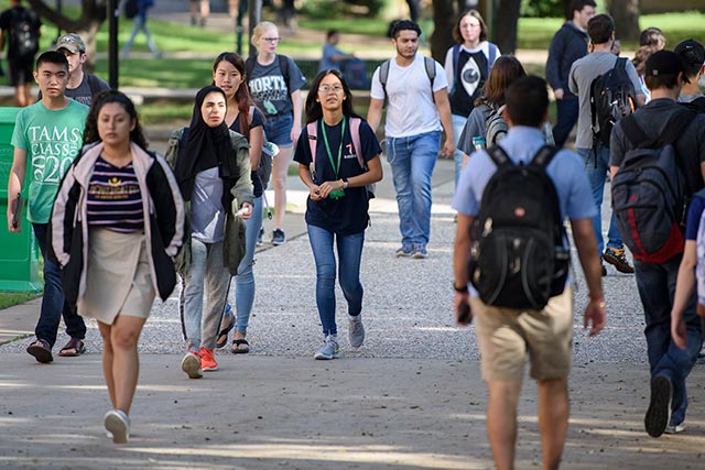 Students walking near the Life Sciences building at UNT.