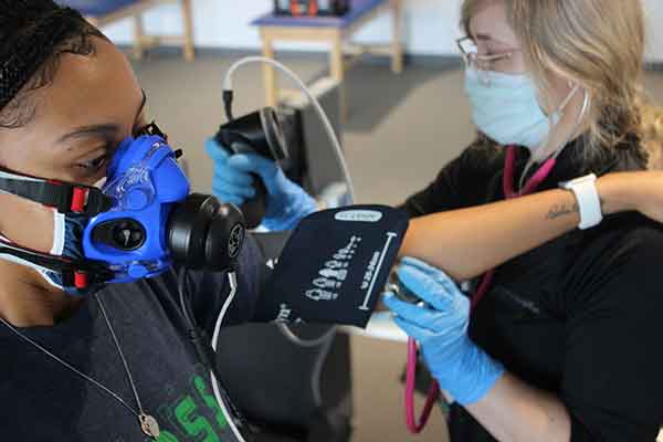 A student's heart rate, blood pressure and oxygen is evaluated following exercise. 