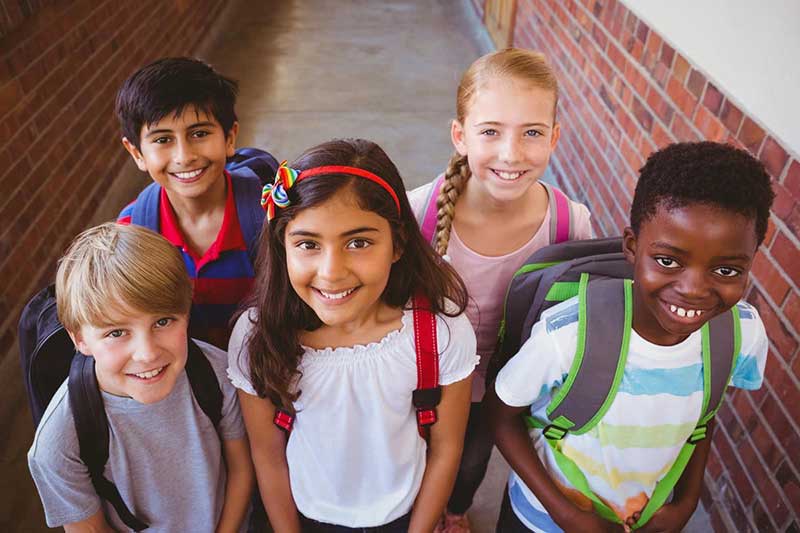 Group of smiling elementary students.