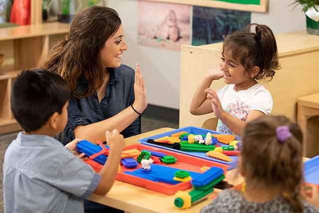 UNT Student Teacher working with young children at the Child Development Lab