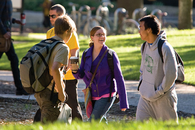 Students walking through the UNT campus in the fall.