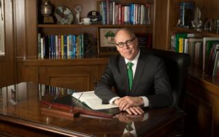 UNT President Neal Smatresk sits at his desk in his office.