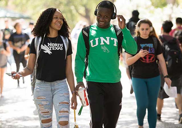 Two students walking on campus