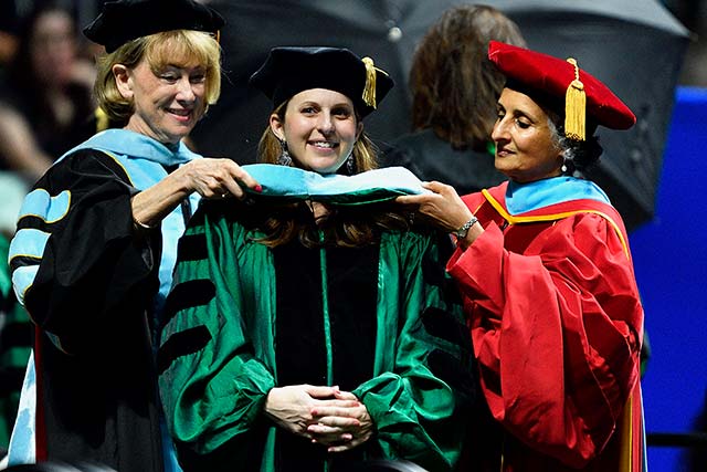 A graduate student at commencement
